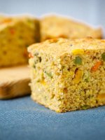 Eye catching confetti cornbread is a healthy barbecue side with bursts of sweet corn and spicy jalapeños. Soft and springy cornbread with easy low-fat swaps