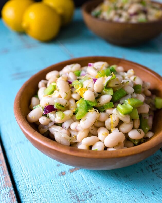 Thanks to the simple fresh flavors lemon dill navy bean salad has a lightness you might not expect from a bean salad. Quick & easy 15 minute no-cook recipe.