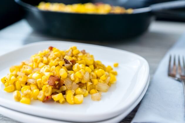 Tender fresh corn with crispy bacon is the exact right balance of salty with starchy sweet. An easy recipe for a healthy comfort food side dish.