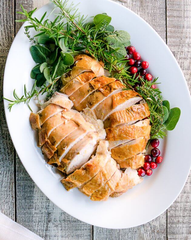 Roast turkey breast turns out tender and flavorful with this easy recipe using lemon-herb butter. Perfect for small holiday meals.